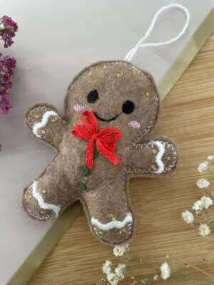 Mézeskalács figura piros masnival